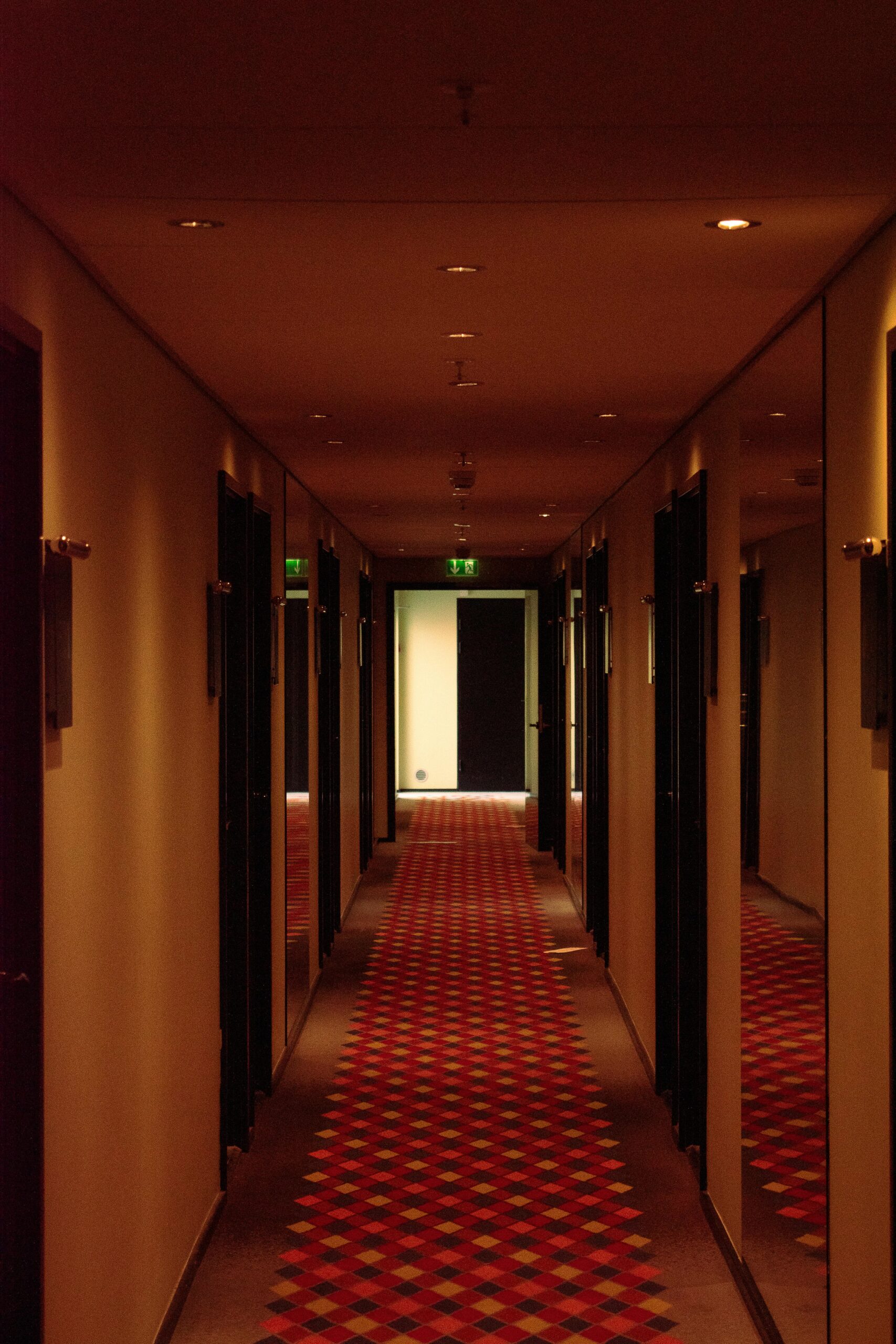 dark hotel hallway at night guest disturbance response small hotel