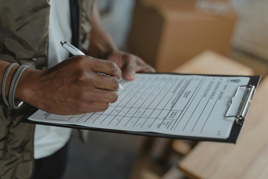 hotel staff documenting security incident report on clipboard